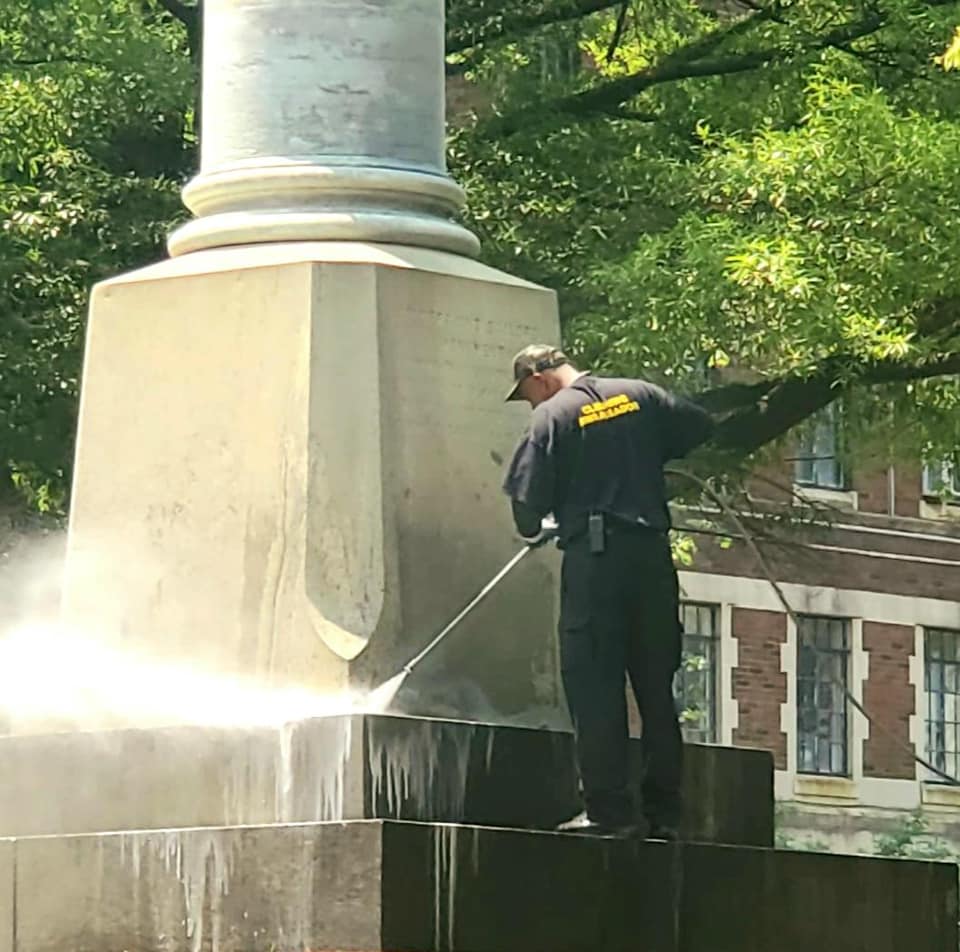 Downtown Visions Cleaning Ambassadors work with the Wilmington Department of Parks & Recreation to get the Soldiers and Sailors Monument ready for this year’s Memorial Day parade. (Downtown Visions photo)