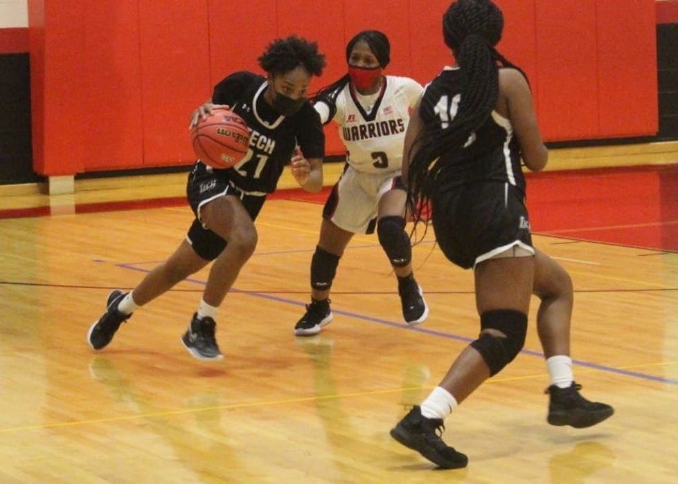 Maleyah Bell drives the ball against Wilmington Christian