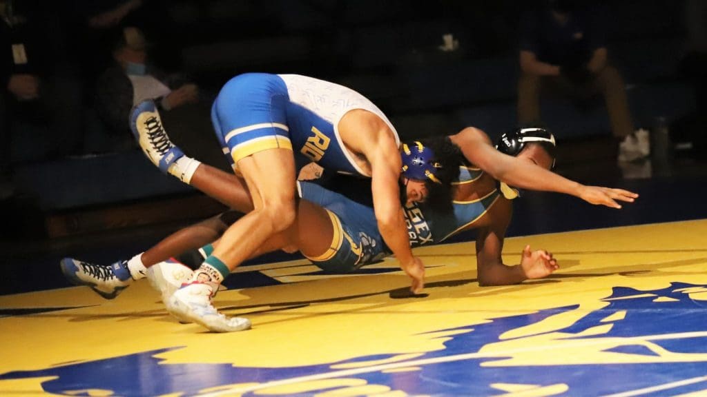 Caesar Rodneys Brock Conner finishes a takedown on Ivan Neal of Sussex Central during their 170 pound bout. Conner won an 8 5 decision. Photo by Michael Williams