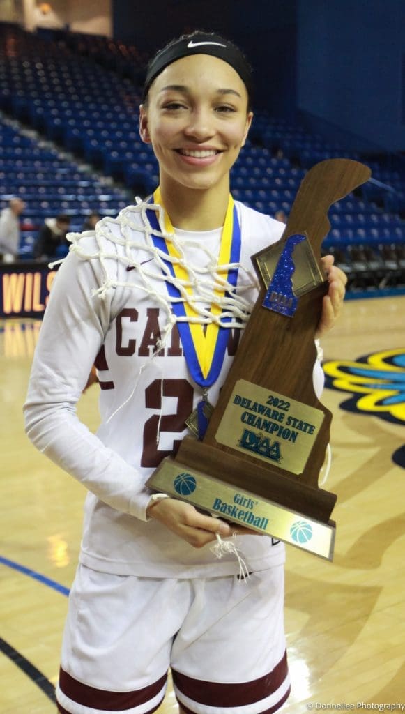 India Johnston holding the state championship trophy photo by Donnell Henriquez