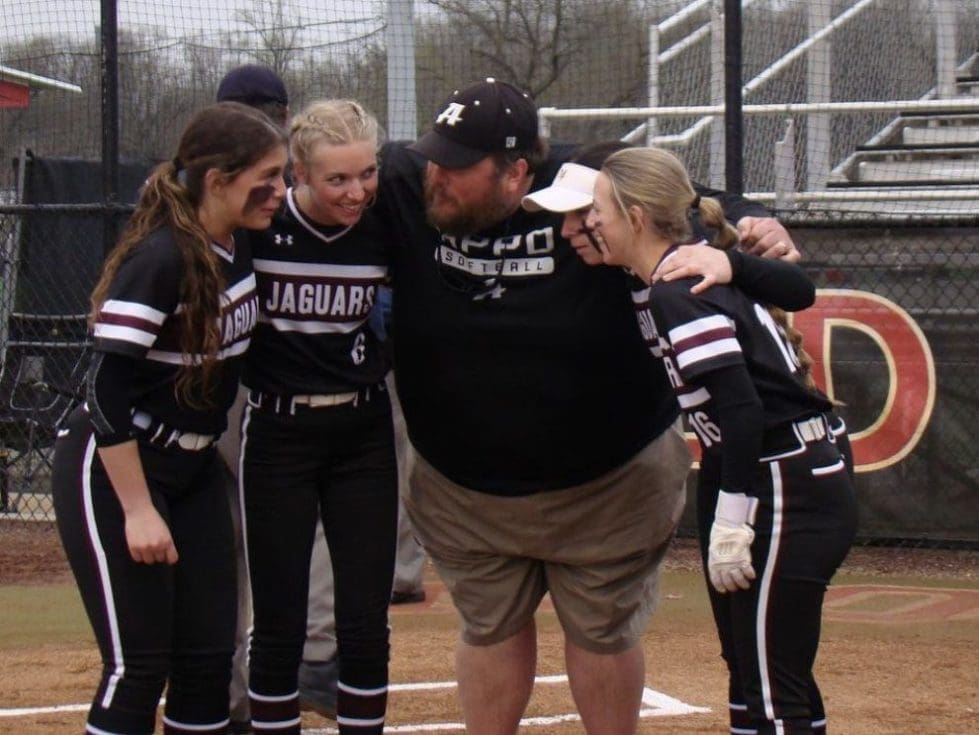 Appoquinimink Coach Brian Timpson huddles with a few players from his team photo courtesy of Appo Softball Instagram 1 3
