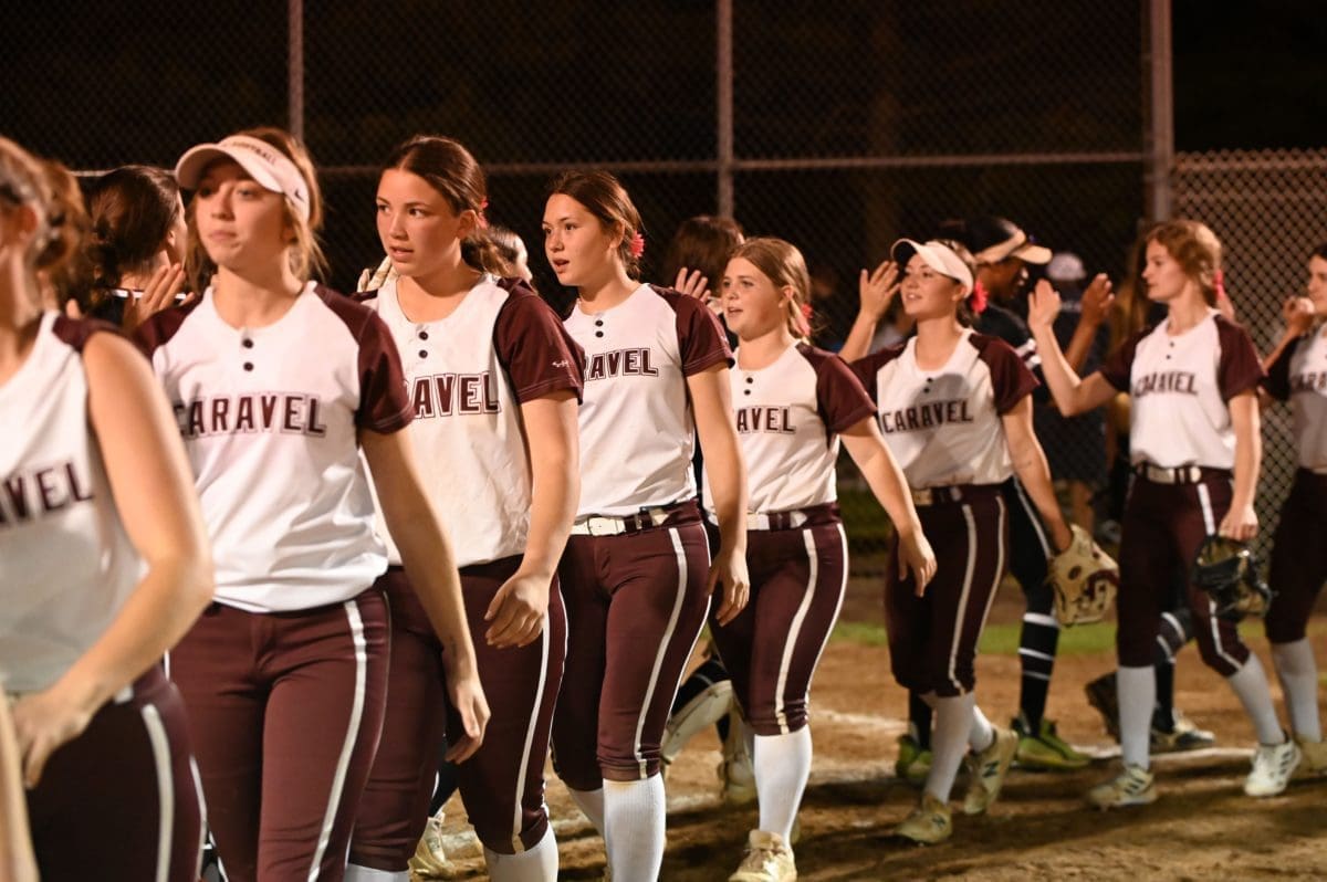 Caravel Softball team shaking hands after defeating Appoquinimink photo by Nick Halliday