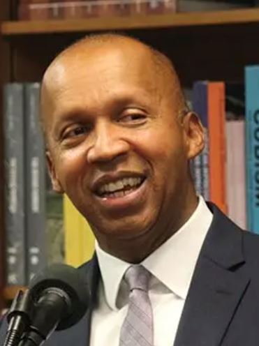Bryan Stevenson wearing a suit and tie