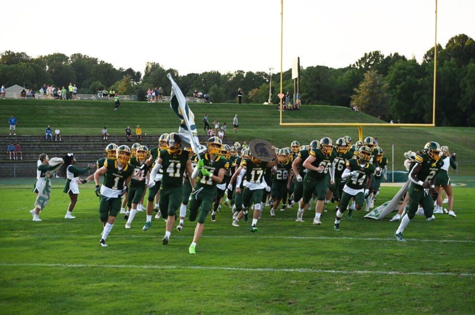 Saint Marks football team running out on the field photo by Nick Halliday 1