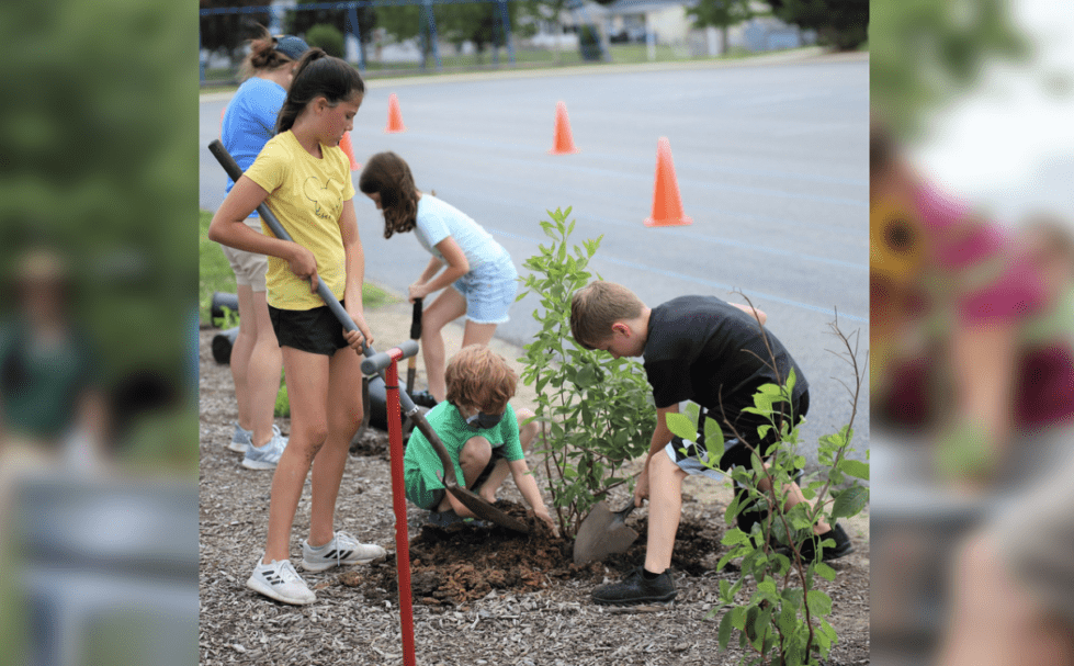 Caesar Rodney students planting as part of their environmental studies. (Courtesy of Caesar Rodney School District Facebook).