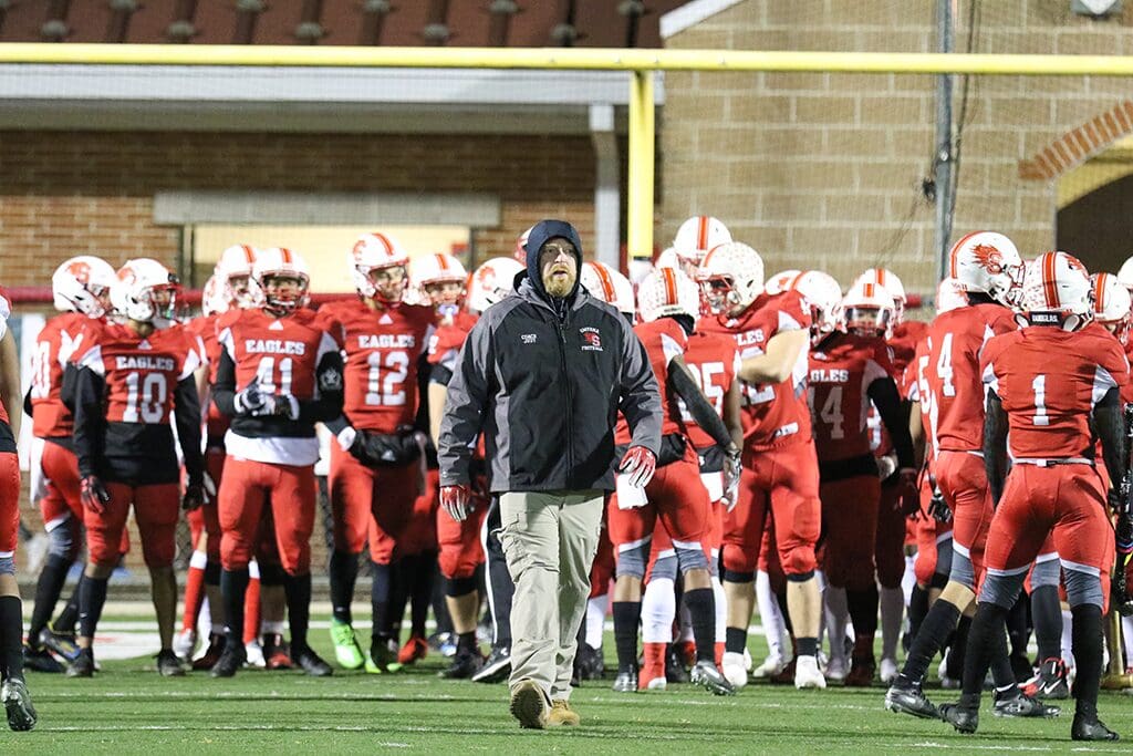 Smyrna Football Coach Mike Judy walking out in front of his team Photo by Donnell Henriquez