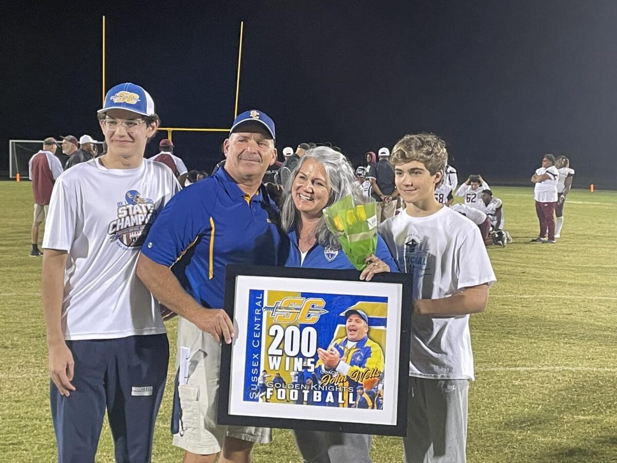 Sussex Central Football Coach John Wells poses with his 200th career victory picture photo courtesy of Sussec Central Athletics