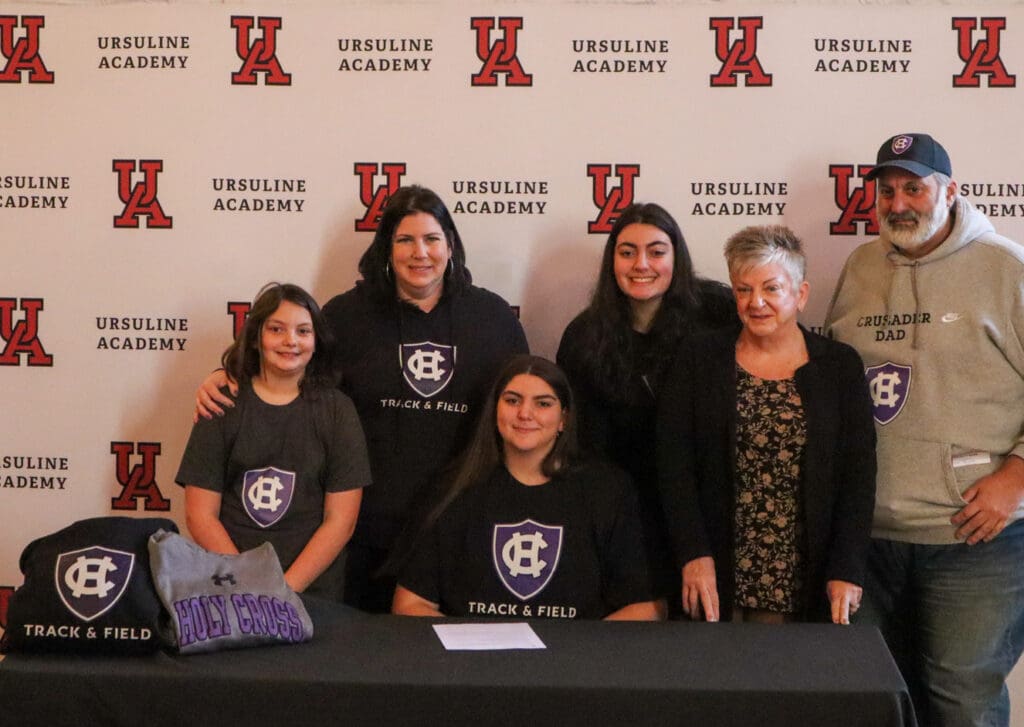 Gabriella Paolella accompanied by her family after signing her letter of intent to attend the College of the Holy Cross for track and field. (Jarek Rutz/Delaware LIVE News)