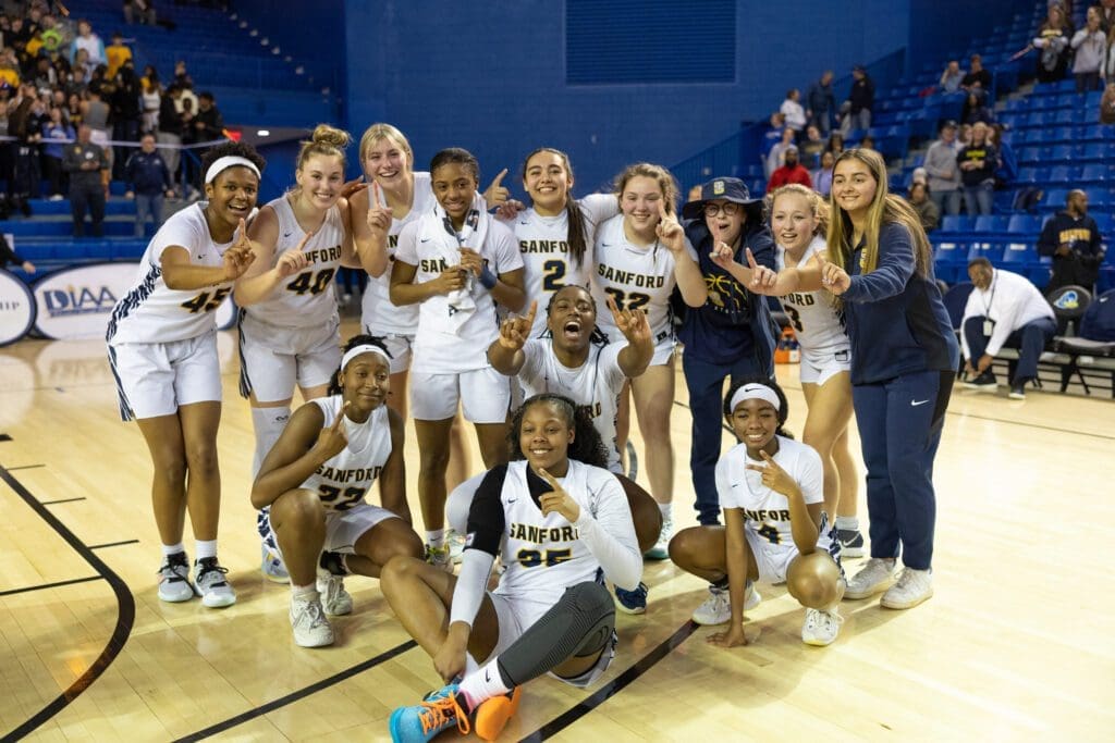Sanford girls basketball team showing they are number one after winning the diaa girls basketball state championship photo by Donnell Henriquez 2