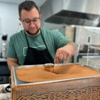 Cafeneo's offerings: Greek pastries, coffee brewed in sand