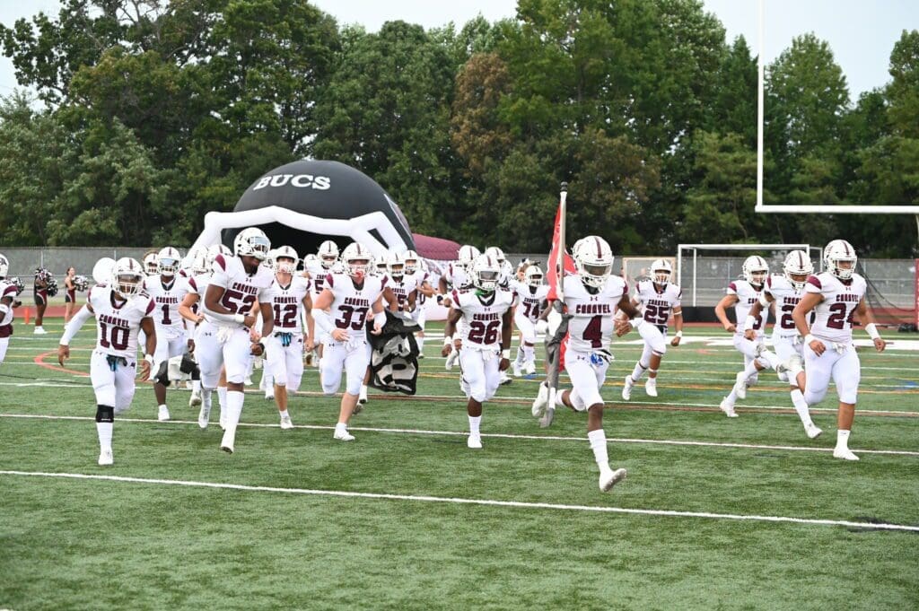 Caravel Academy football team running out in the before the game against Hodgson photo courtesy of Nick Halliday