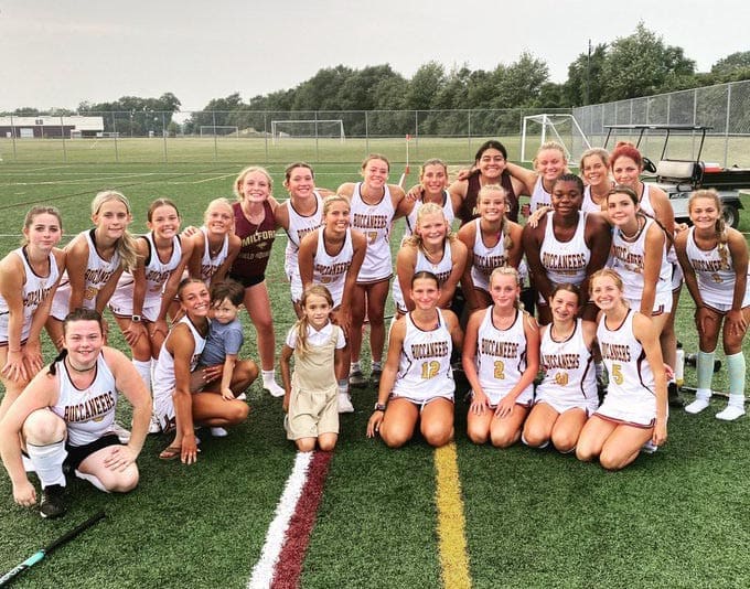 Milford Field Hockey team posing after a win photo courtesy of Milford Athletics Twitter