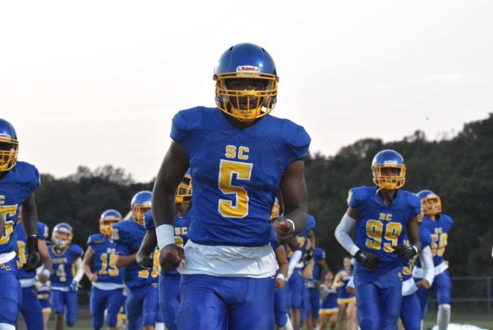 Sussex Central Malik Bell 5 leads the team out photo courtesy of Ben Fulton