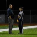 Cape Henlopen head coach Mike Frederick has a discussion with an official photo courtesy of Dave Frederick