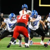 Middletown football offensice line blocks for their quarterback against Smyrna, photo courtesy of Donnell Henriquez