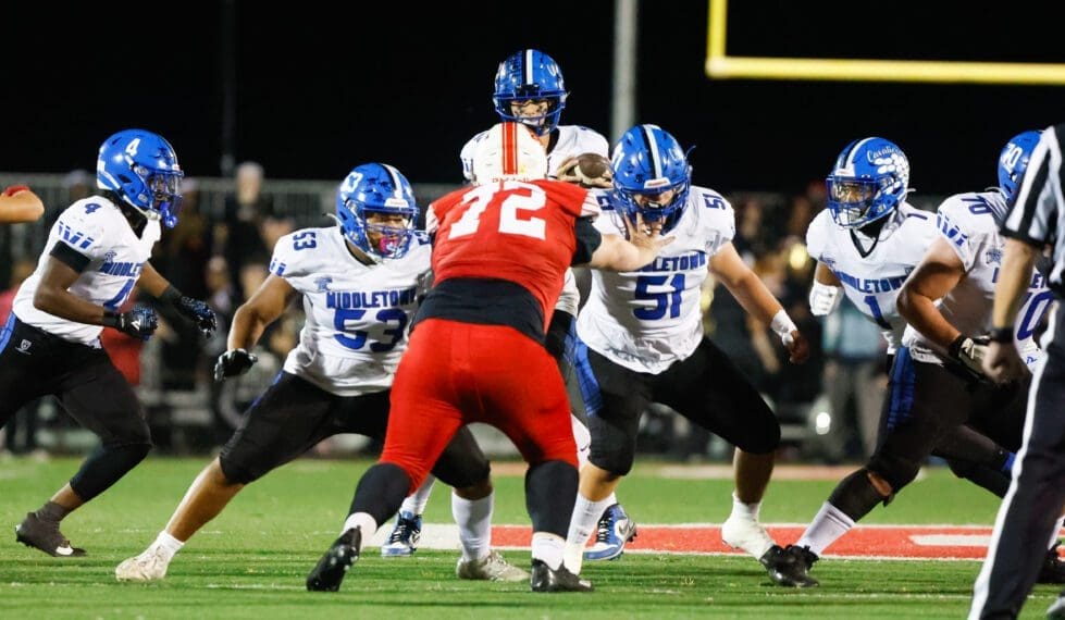 Middletown football offensice line blocks for their quarterback against Smyrna photo courtesy of Donnell Henriquez