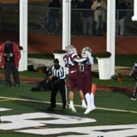 Caravel football Ira Yates and Brock Rhoades celebrate after a touchdown, photo courtesy of Nick Halliday