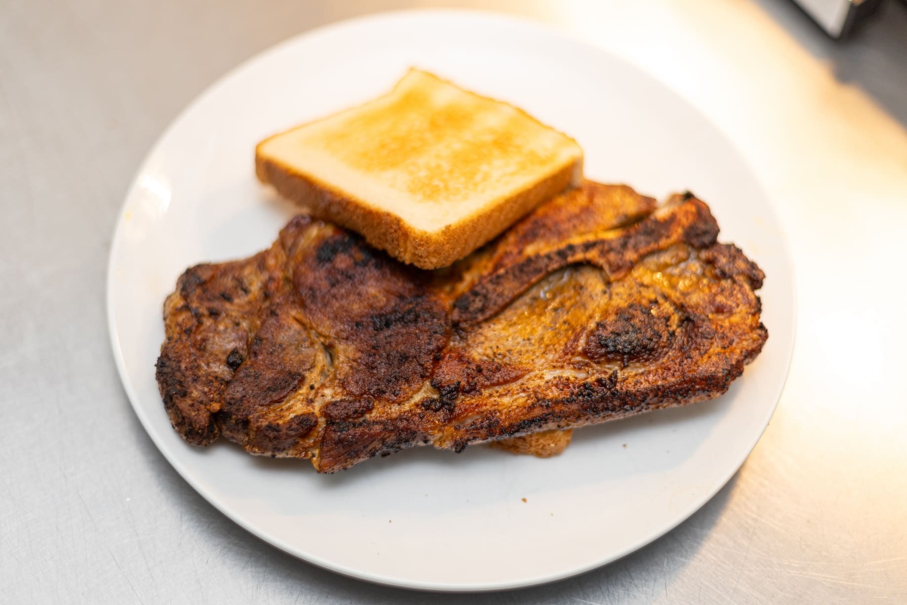 Meaty pork chops are one of the most popular items at Helen's Sausage House. (Pam George photo)