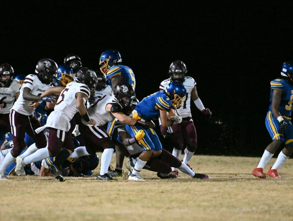 Sussex Central football Will Harmon runs as multiple Appoquinimmink Jaguras try to tackle him. photo courtesy of Ben Fulton