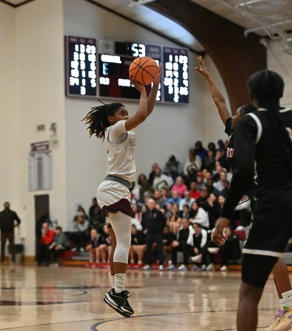 Caravel girls basketball Chasity Wilson attempts a shot against Ursuline photo courtesy of Nick Halliday