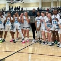 Everett Meredith Middle School girls basketball poses with the championship trophy  after going a perfect 14-0, photo courtesy of Shola Cooke