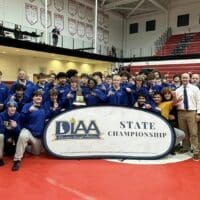 Sussex Central Division I wrestling state champions posing with the state championship trophy, photo courtesy of Sussex Central Facebook