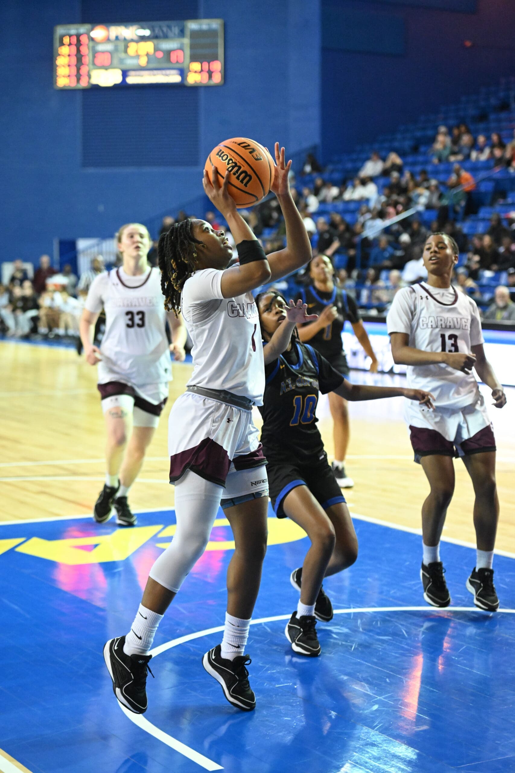 Caravel Academy Chasity Speedy Wilson attempts a layup against AI int he girls DIAA quarterfinals Photo courtesy of Ben Fulton scaled