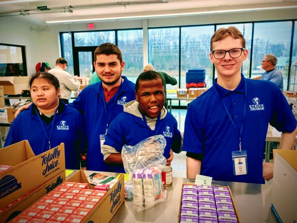 Madison Madlangbayan, Tommy Walker, Jahwuille Goode and Ian Sullivan at the Food Bank of Delaware. (Katie Kazimir photo)