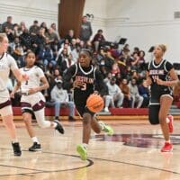Ursuline Academy girls basketball GG Banks drives against Caravel, photo courtesy of Ben Fulton