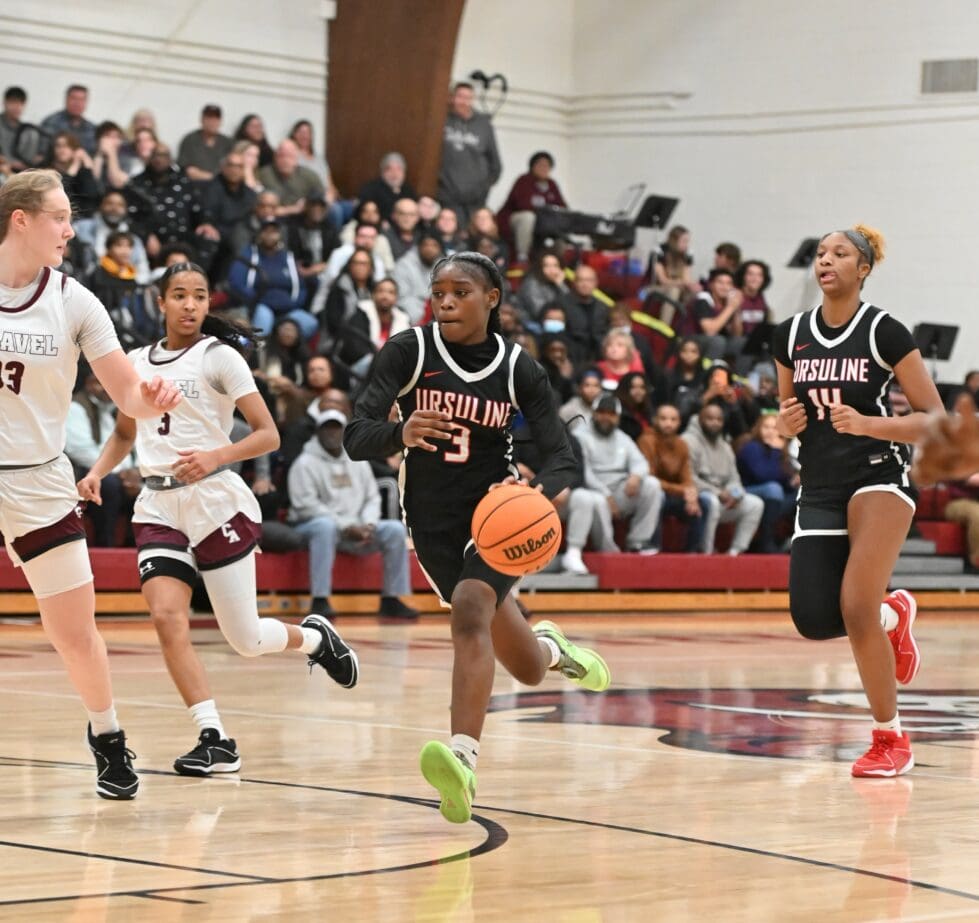 Ursuline Academy girls basketball GG Banks drives against Caravel photo courtesy of Ben Fulton