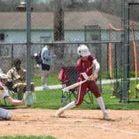 Caravel softball Leah Richardson swings at a pitch. Photo by Nick Halliday