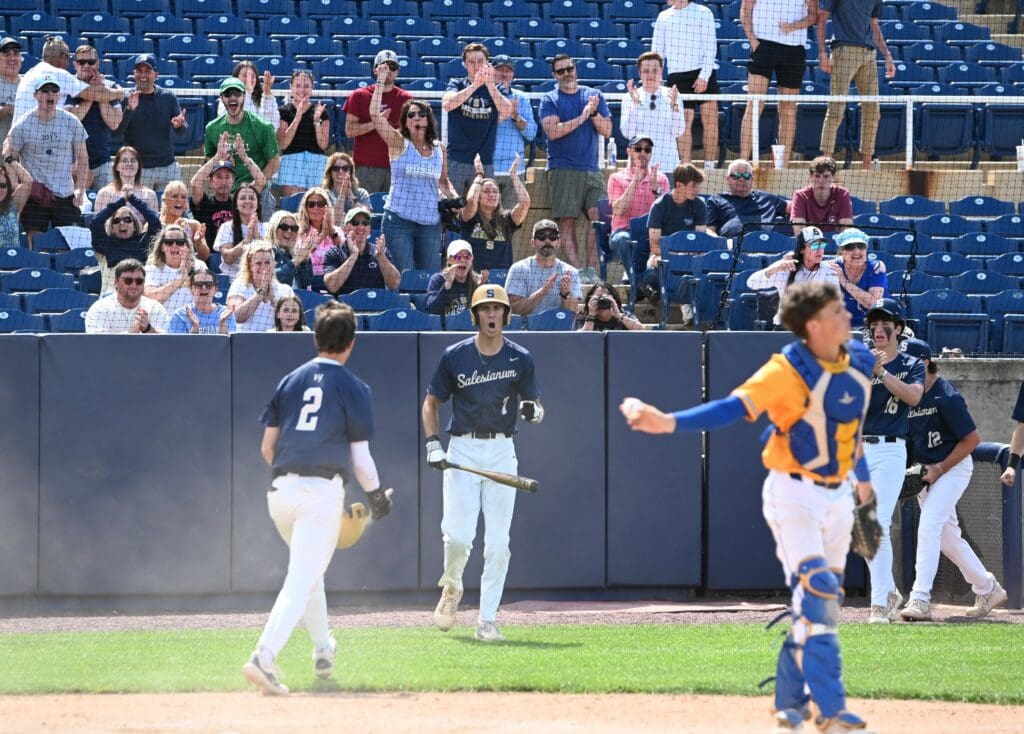 Salesianum baseball team celebrates after a run scores in their win over Sussex Central. Photo by Nick Halliday