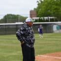 Wilmington softball head coach Mike Shehorn coaching third base in the win over Bridgeport. Photo by Nick Halliday
