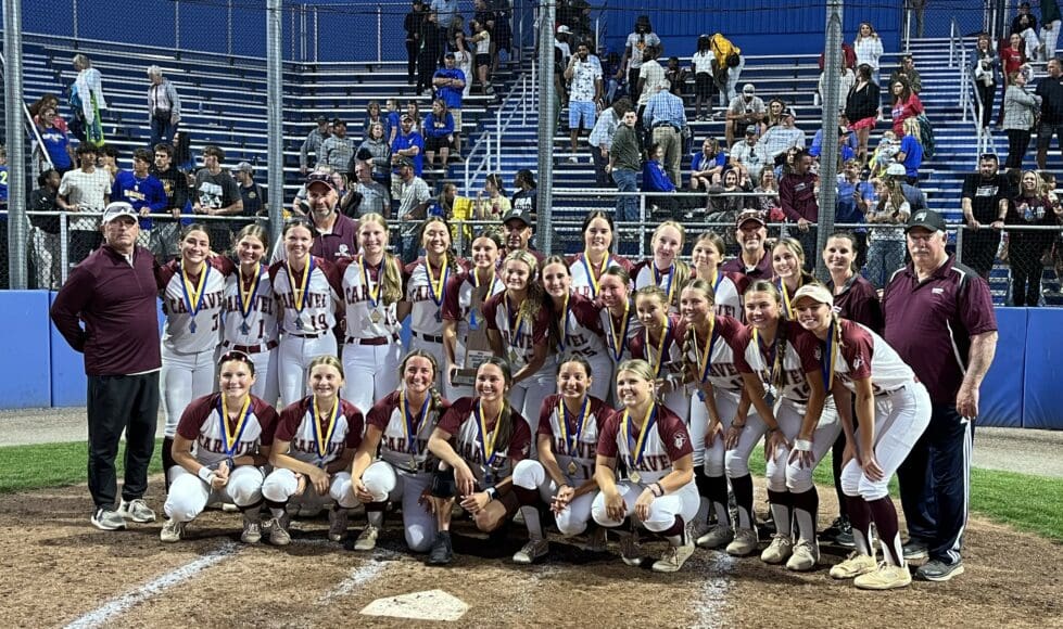 Caravel Academy softball team poses with the DIAA softball state championship trophy after defeating Sussex Central. Photo by Shannon Timmons