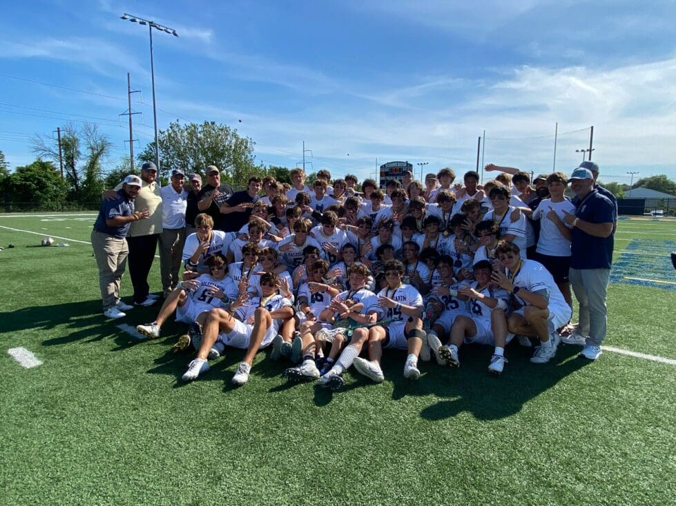 Salesianum boys lacrosse poses with the state championship trophy after winning their fourth straight. Photo courtesy of Mike Lang