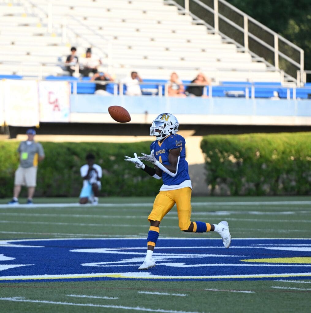 Vandrick Hamlin catches a pass in the 68th Blue Gold foorball game. Photo by Ben Fulton