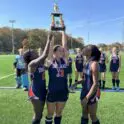 Delmar Wildcats field hockey team lifts the Henlopen championship trophy after defeating Cape Henlopen. Photo courtesy of Delmar Field Hockey Facebook