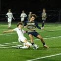 Caesar Rodney Trevor Sullivan slide tackles Salesianums Tyler Cifa. Photo by Nick Halliday