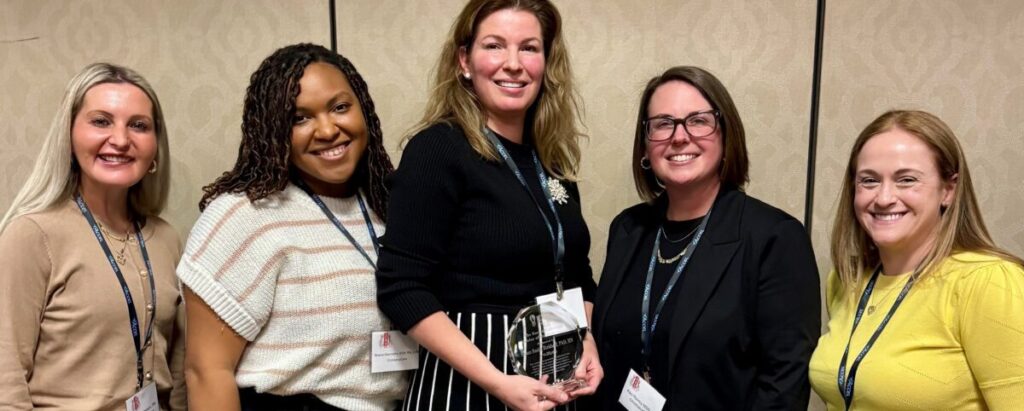 Susan Smith Birkhoff, Ph.D., RN. accepting her award with her colleagues. (PHOTO FROM christianacare.org)
